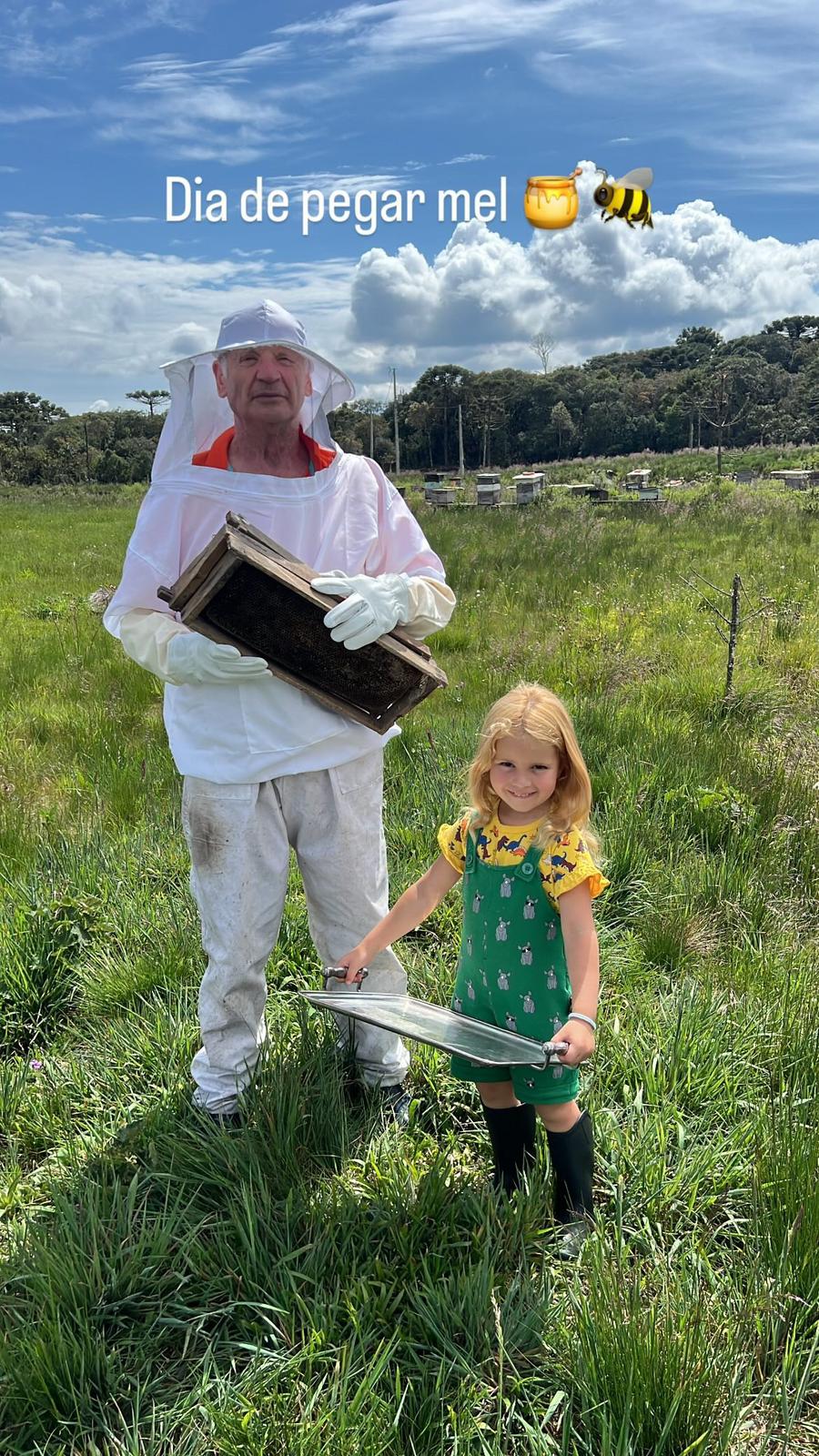 Trinity and grandfather on beekeeping day